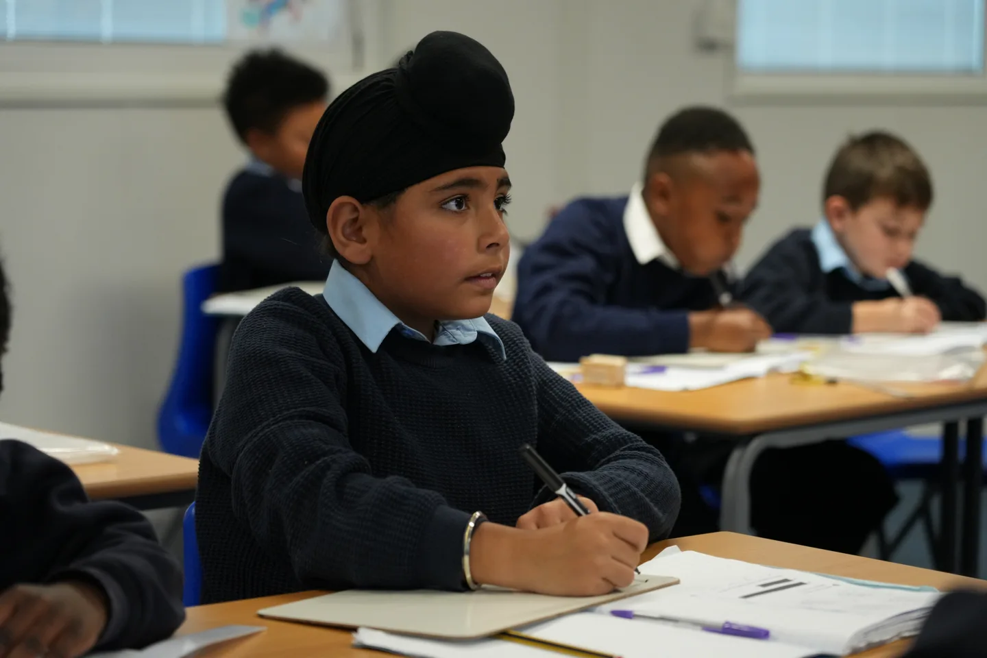 A St John’s pupil concentrating on his classroom learning